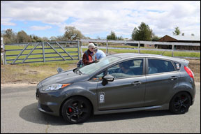 gray Mazda at check point